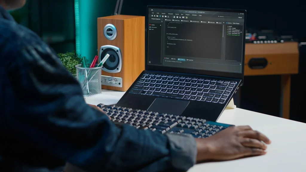 teleworker-using-laptop-coding-software-developing_person-front-computer-working-teckclick.io